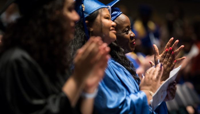 Graduates applaud at the Commonwealth Secondary School Diploma Citywide Graduation, held in June.