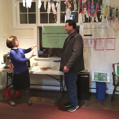 Claire Nevin-Field stands near church member at Zero Waste Coffee Hour