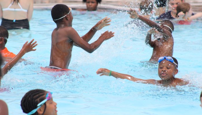 Children playing in a pool.