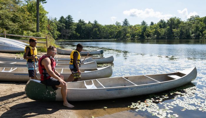 Camp Philly campers with canoes.