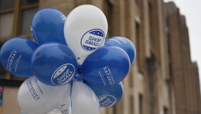 Balloons that say "Shop Small"