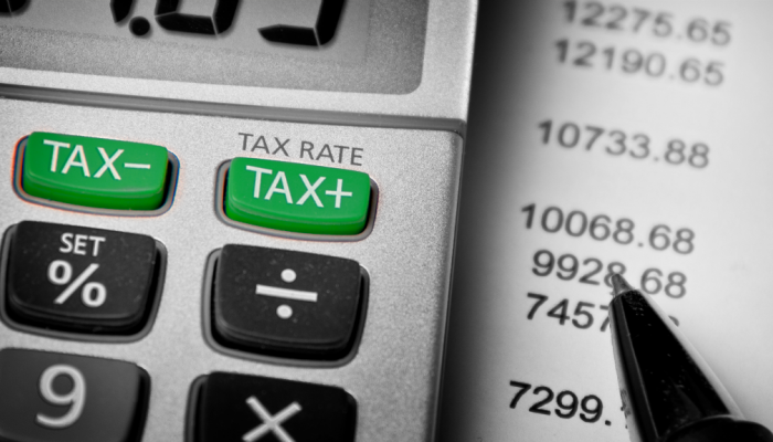 An accountant's calculator and a pen