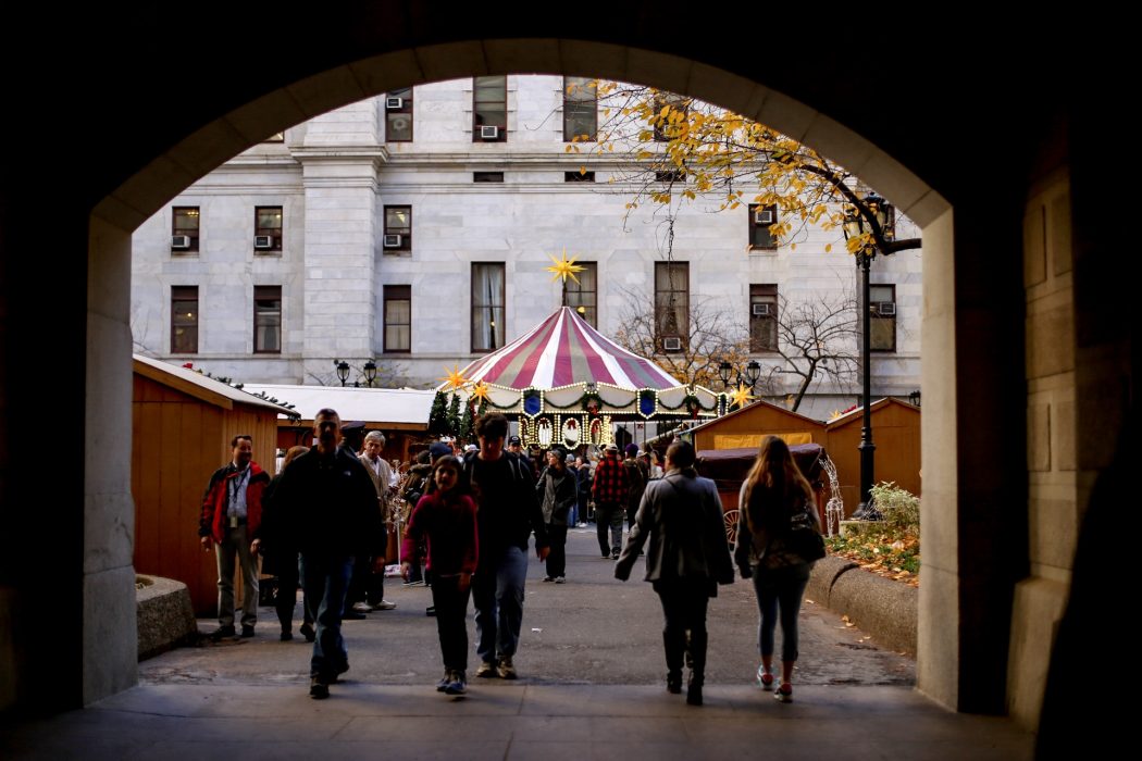 People gather in City Hall Courtyard