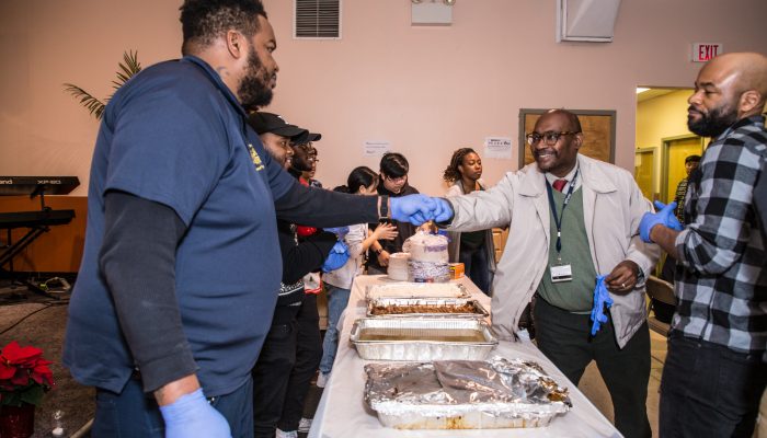 Men serving food.