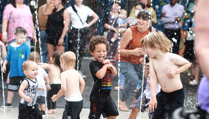 Child plays in sprayground