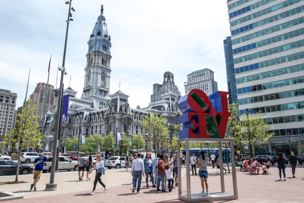 Philadelphia City Hall with people walking around.