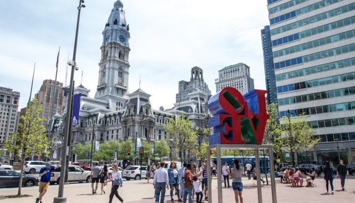 Philadelphia City Hall with people walking around.