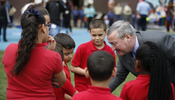 mayor kenney shaking hands with students