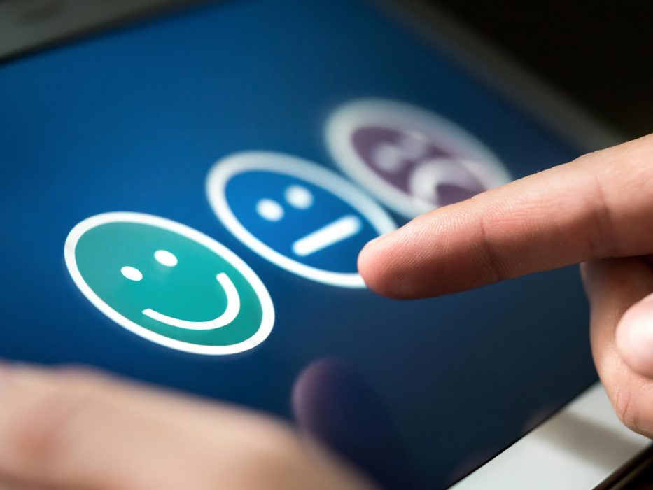 Happy, neutral and unhappy emoji faces