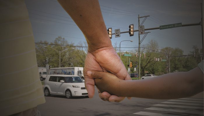 Holding Hands crossing the street