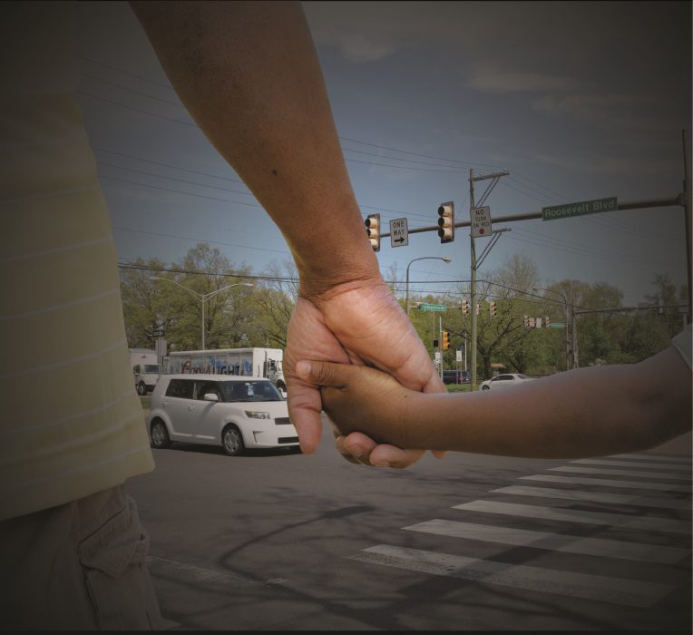 Holding Hands crossing the street