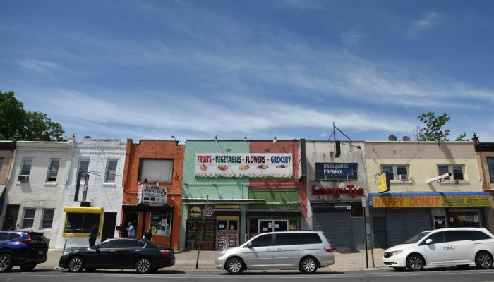 Closed storefronts along a Philadelphia commercial corridor