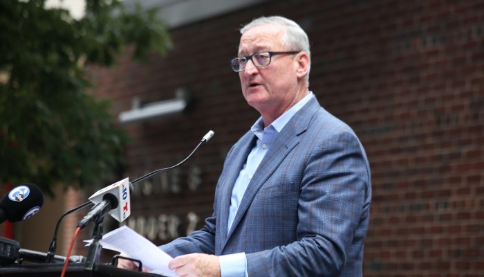 Mayor Kenney speaks from a podium outside