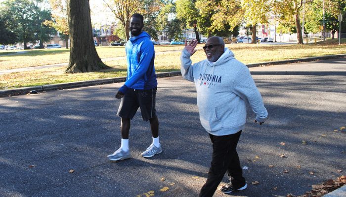 Men walking in a park