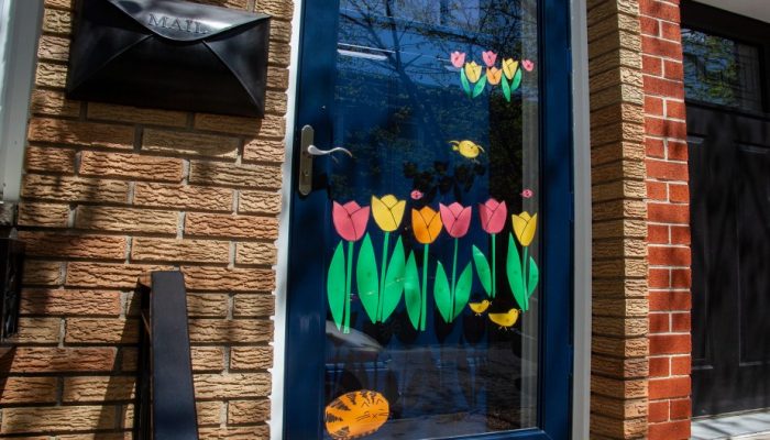 spring flowers painted on a residential home front door