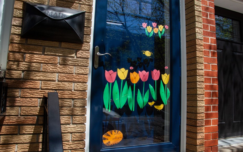 spring flowers painted on a residential home front door