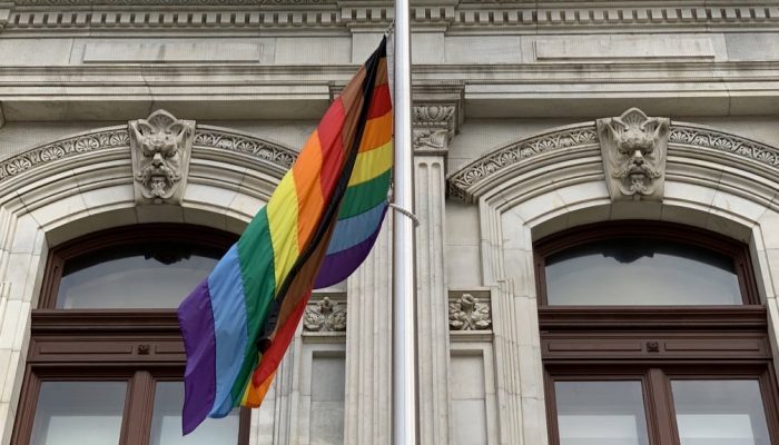 More Color More Pride version of the LGBTQ Pride flag with additional stripes to represent Black and Brown LGBTQ people.