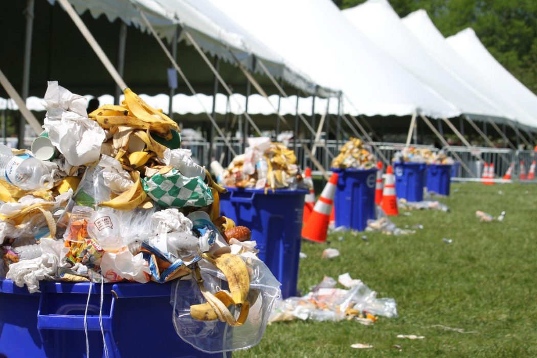 Trash and food waste overflowing from waste bins