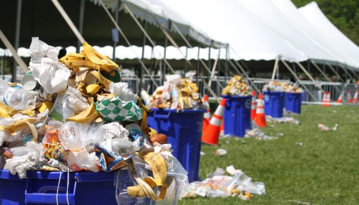 Trash and food waste overflowing from waste bins