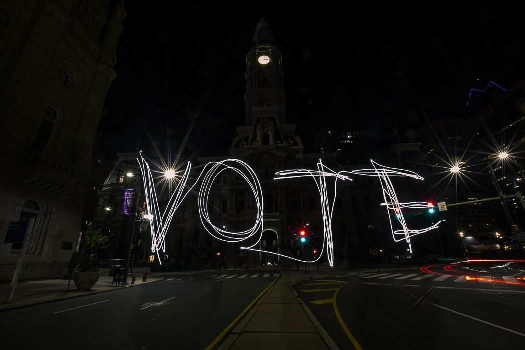 the word vote spelled out in lights