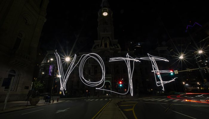 the word vote spelled out in lights