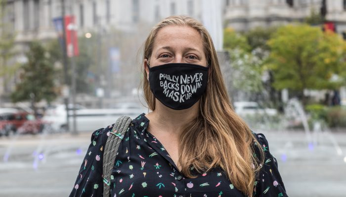 Jeanette wearing a mask that says Philly never backs down. We mask up.