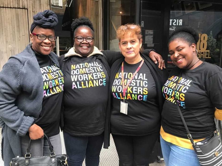 Four women wearing shirts that read "National Domestic Workers Alliance."