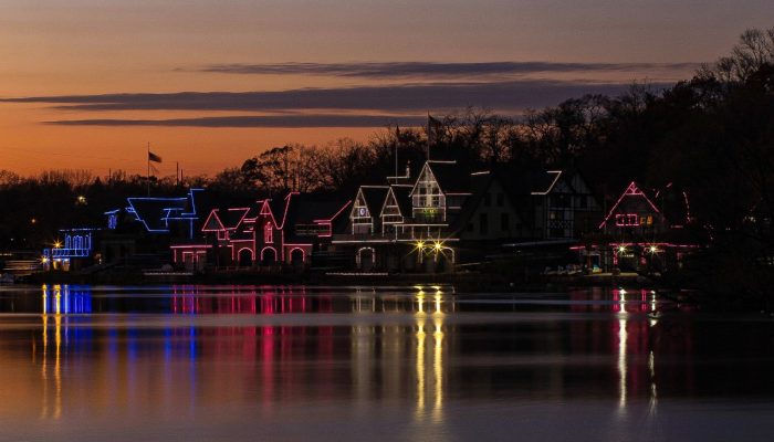 Boathouse Row at dusk. Lit up in the colors of the Transgender Pride Flag—blue, pink, and white.