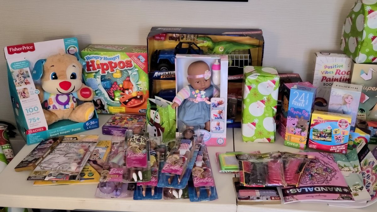 Children's toys sitting on a table demonstrating the wide variety of toys donated to children in the City's Isolation and Quarantine Site