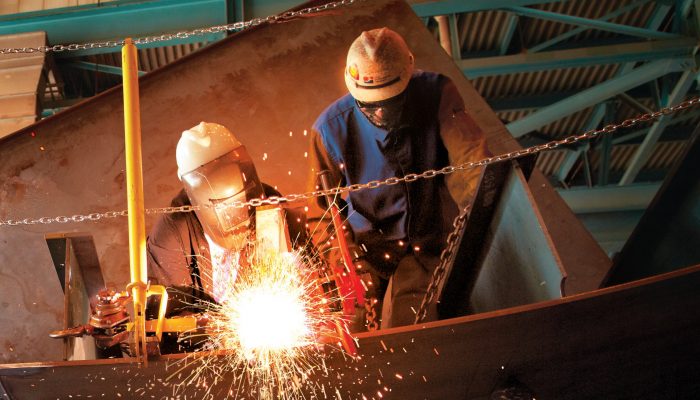 Two workers welding