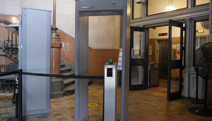 A metal detector in the interior of the City Hall northeast entrance.