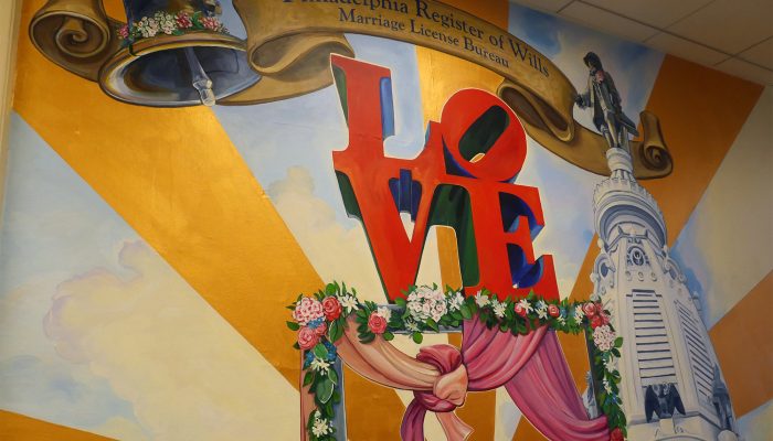 Painted mural on the wall in the Marriage License Office. The mural is of the Love Statue and the City Hall tower.