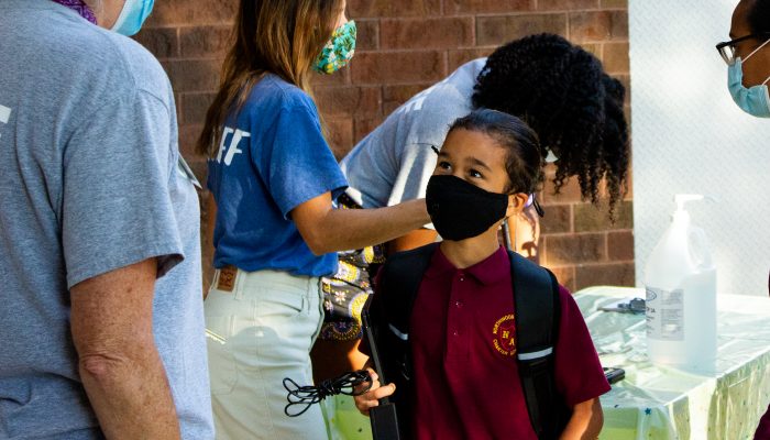 a student receiving a health prescreening outside an Access Center