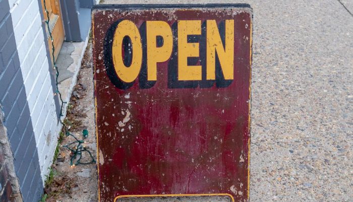 Sign outside signals passersby that shop is open for business