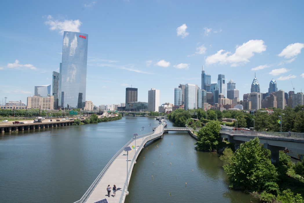the philadelphia skyline on a sunny day from the vantage point of the south street bridge