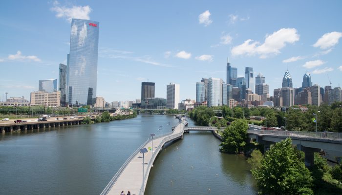 the philadelphia skyline on a sunny day from the vantage point of the south street bridge