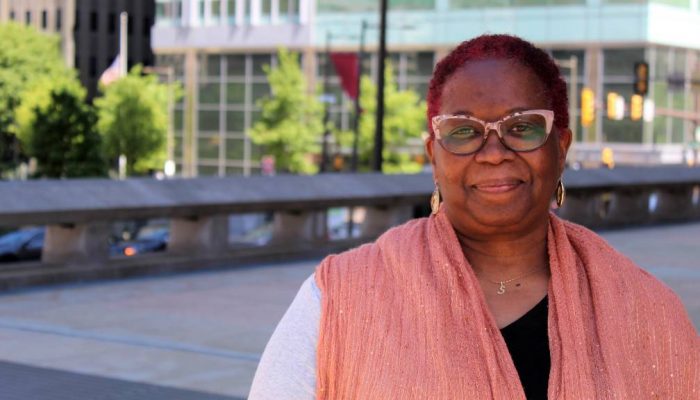 Revenue staff S. Elise King outside the Municipal Services Building