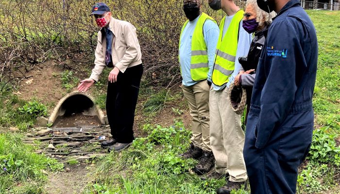 Drew Brown of the Philadelphia Water Department showing how excess untreated water flows down sewer outfalls.