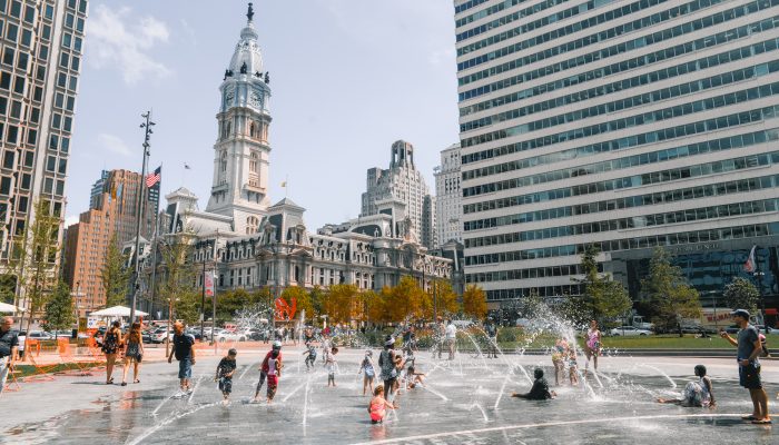 kids running through the splash pad at Love Park