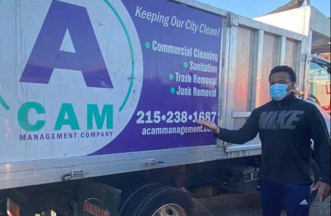 Jeff Fortune, co-owner, standing next to the ACAM Management Company truck.