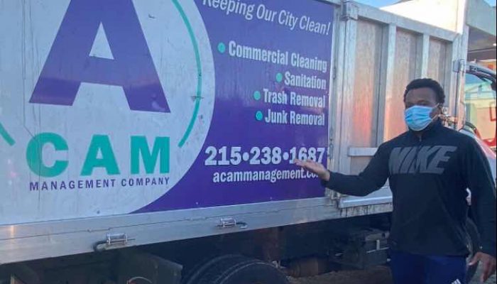 Jeff Fortune, co-owner, standing next to the ACAM Management Company truck.