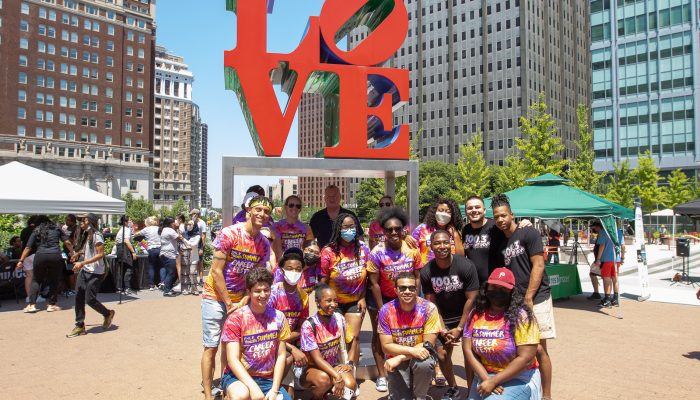 Commission members standing in front of the LOVE sculpture at LOVE park