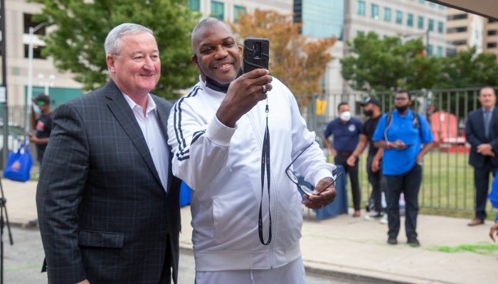 mayor kenney posing for a selfie with a resident
