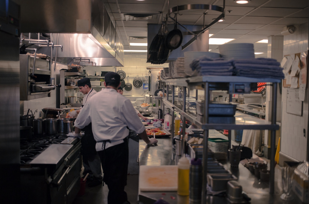 A busy restaurant kitchen with chefs