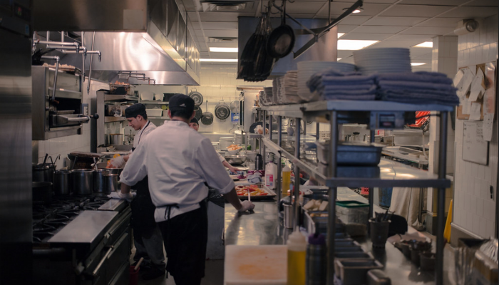 A busy restaurant kitchen with chefs