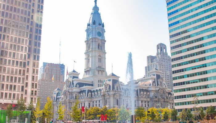 View of CIty Hall from Love Park during the day.