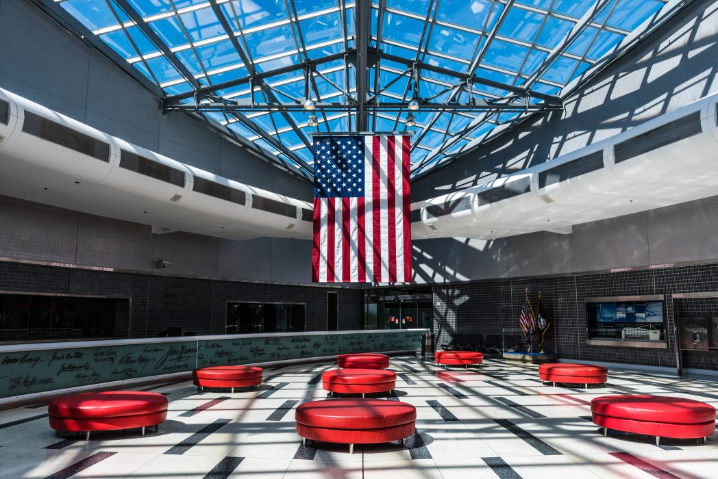 the american flag hanging in the international hall at the Philadelphia airport
