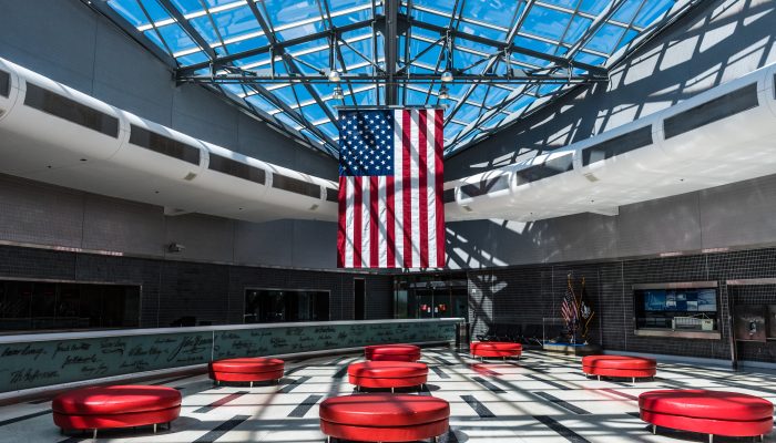 the american flag hanging in the international hall at the Philadelphia airport
