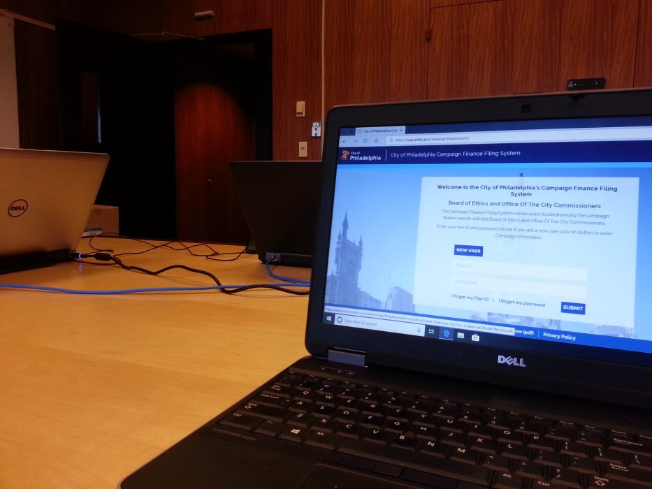 Laptop displaying Philadelphia Campaign Finance Filing System onscreen