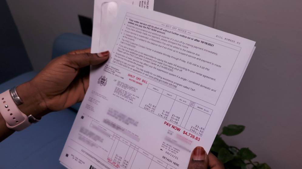 A person reading a tax bill